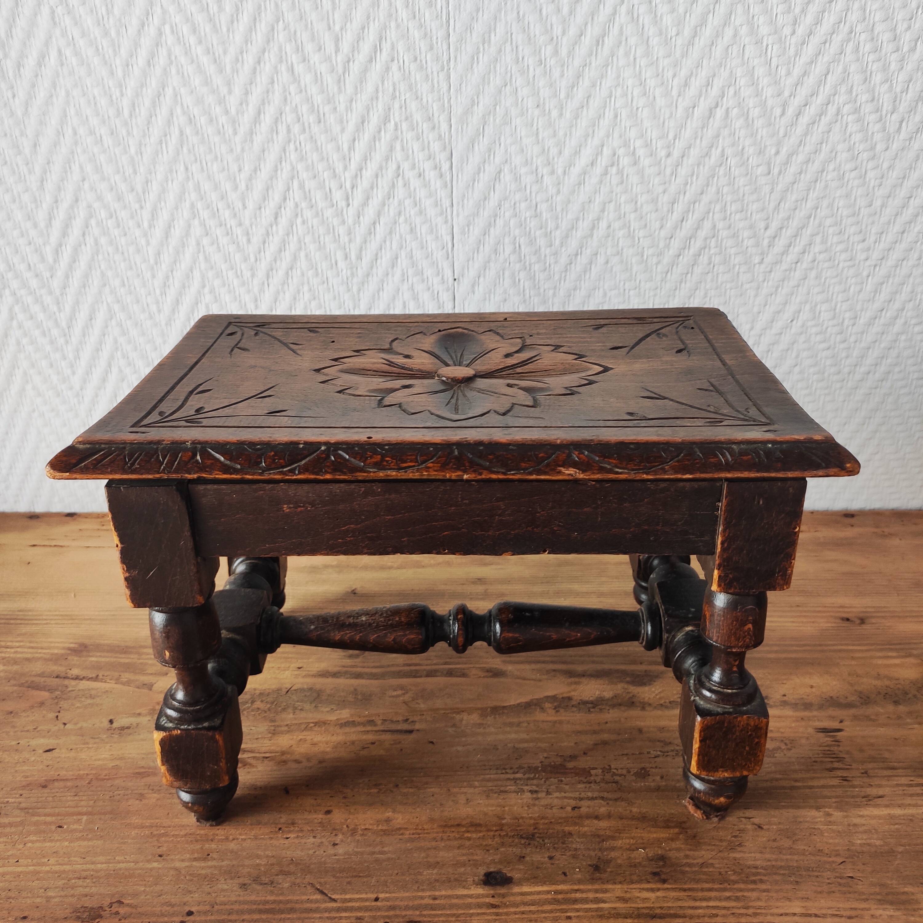 Old carved wooden footrest