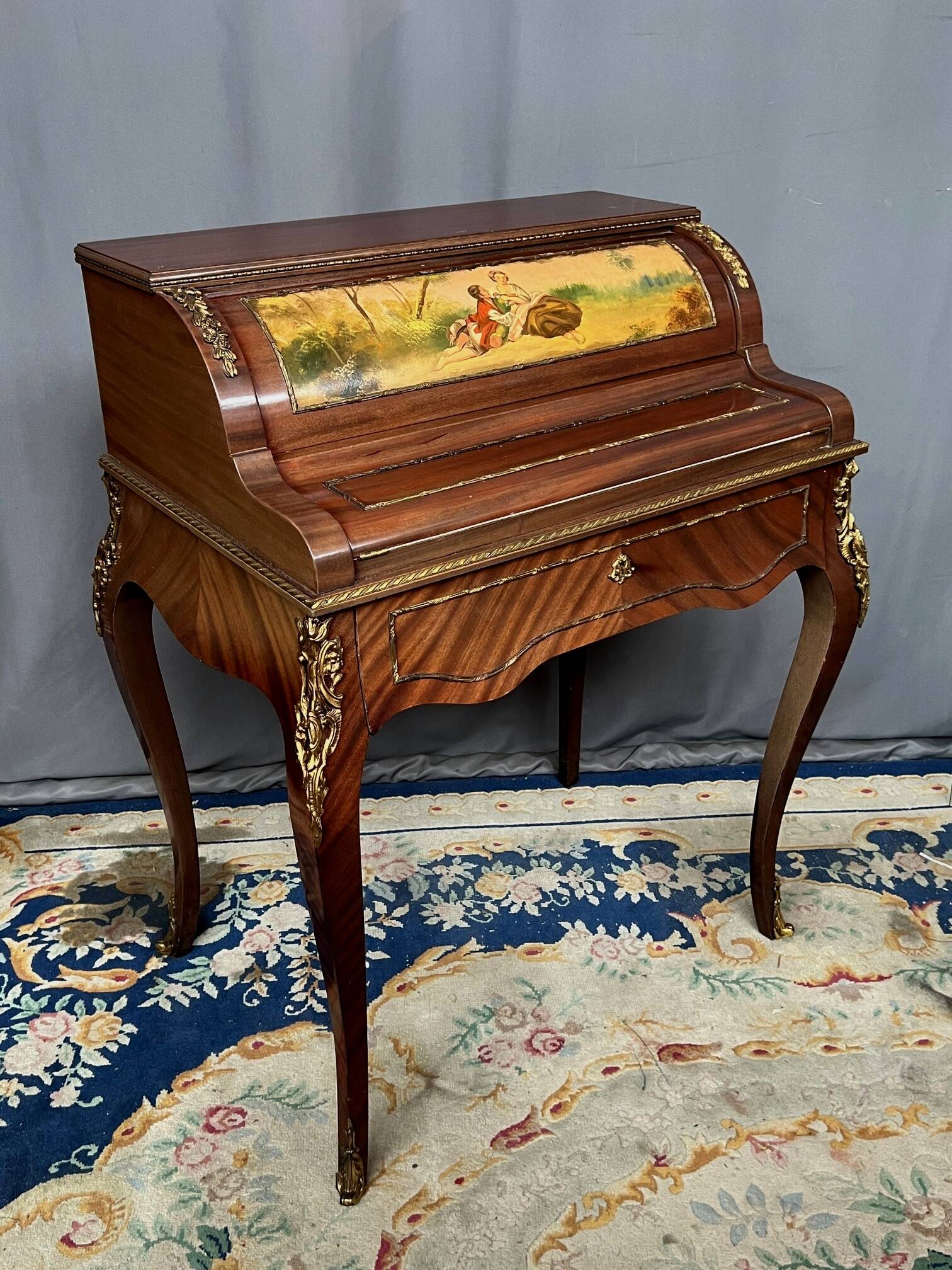 Louis XV style cylinder desk with gilded bronze mounts.