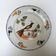Old ceramic plate, hand-decorated, signed: bird on a fence.