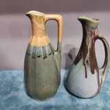 Two enameled stoneware pitchers