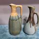 Two enameled stoneware pitchers