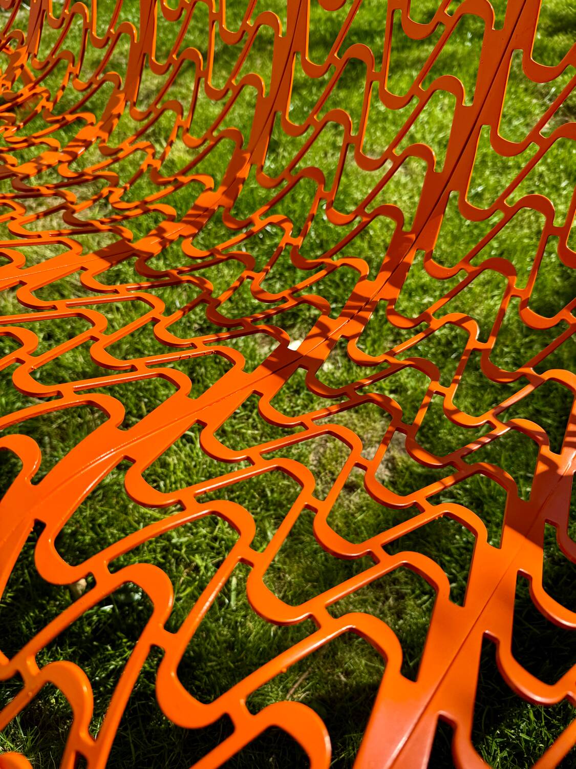 Orange pierced sheet metal bench