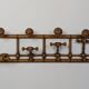 Wall-mounted coat rack made of turned wood