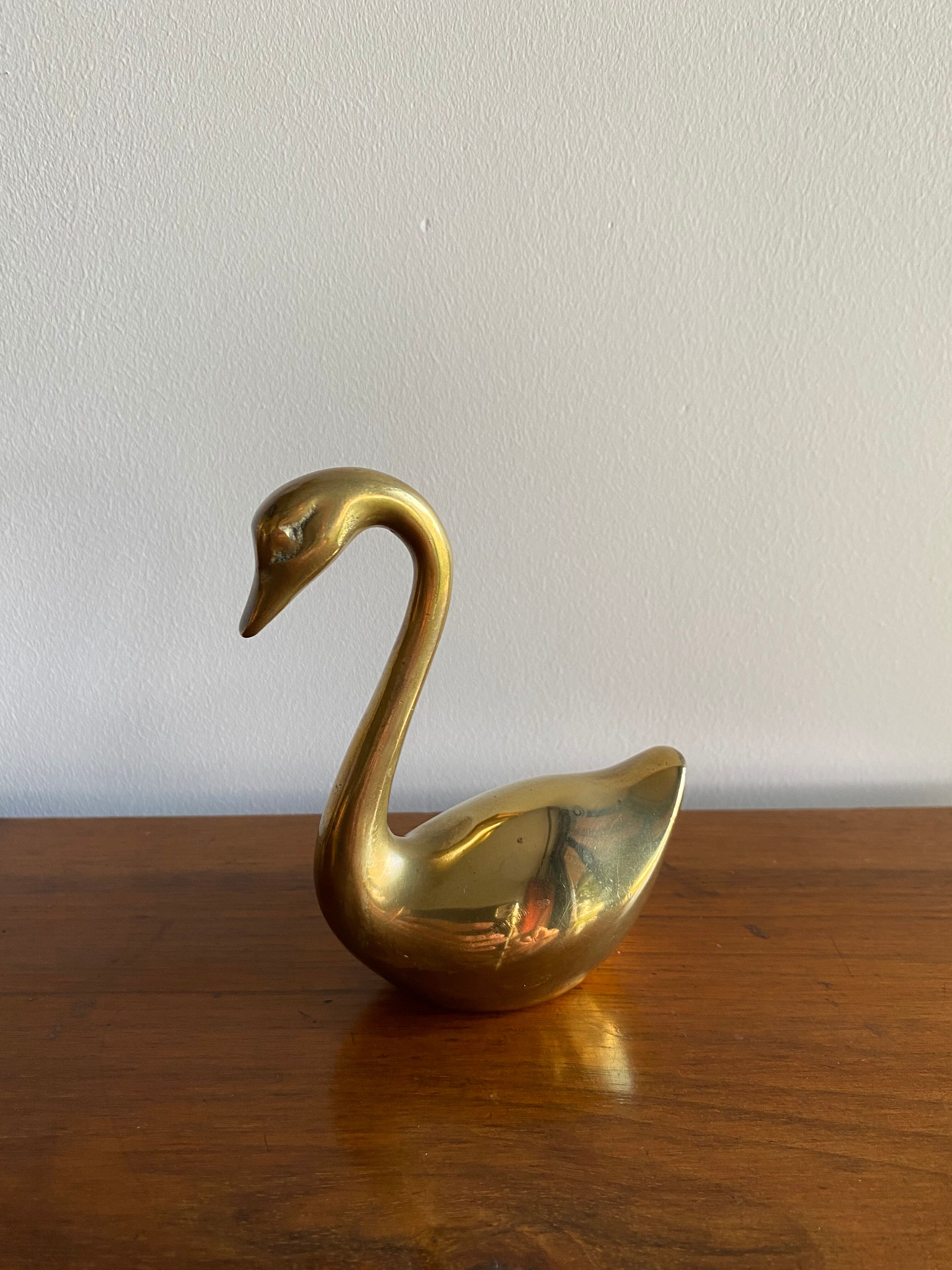 Duo of ancient brass swans