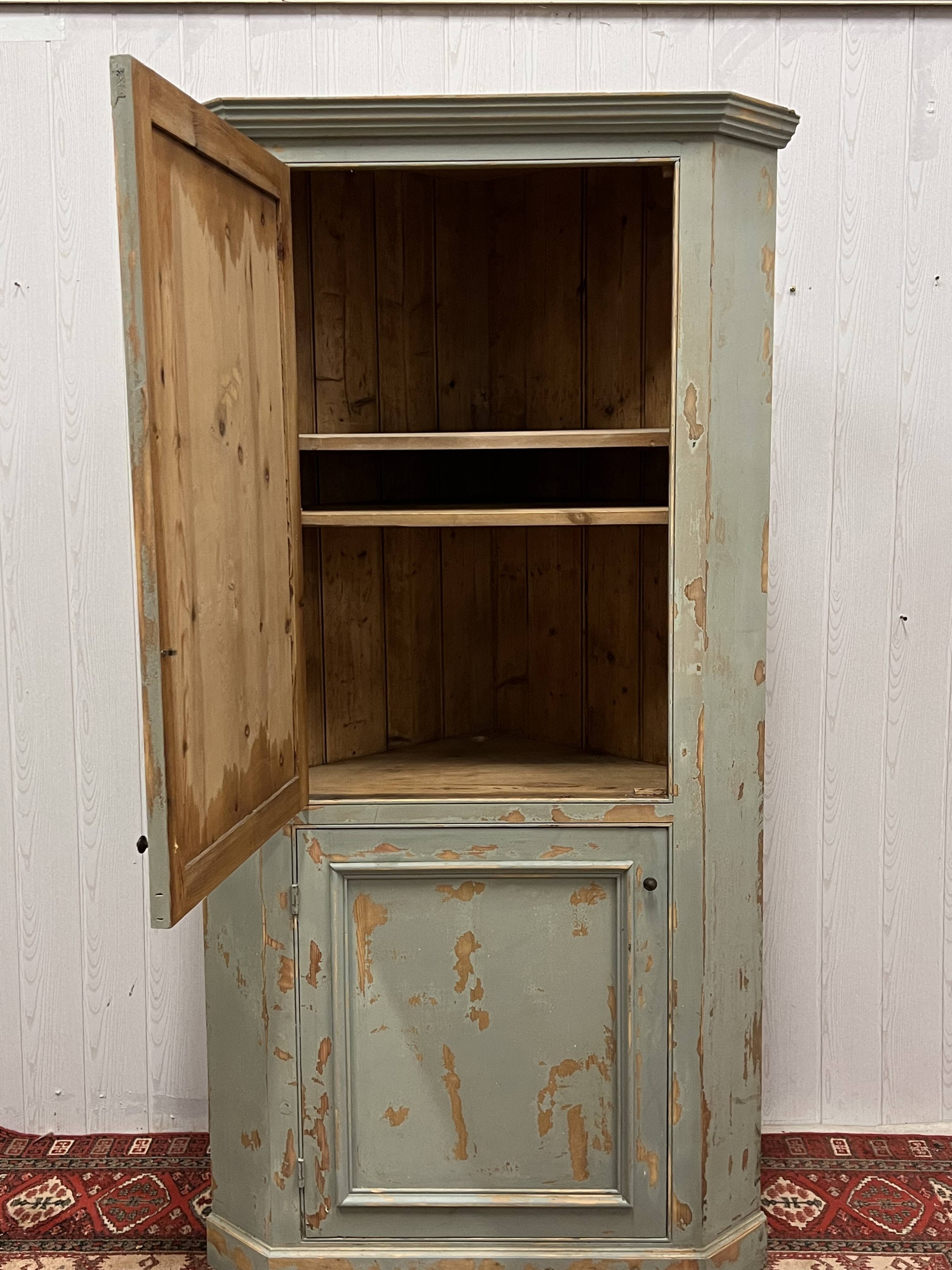 Patinated corner cupboard