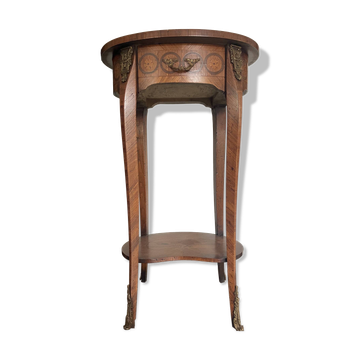 Oval bedside table from the Transition period in marquetry and bronze.