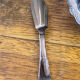 Shell-shaped butter dish in stainless steel and blue glass