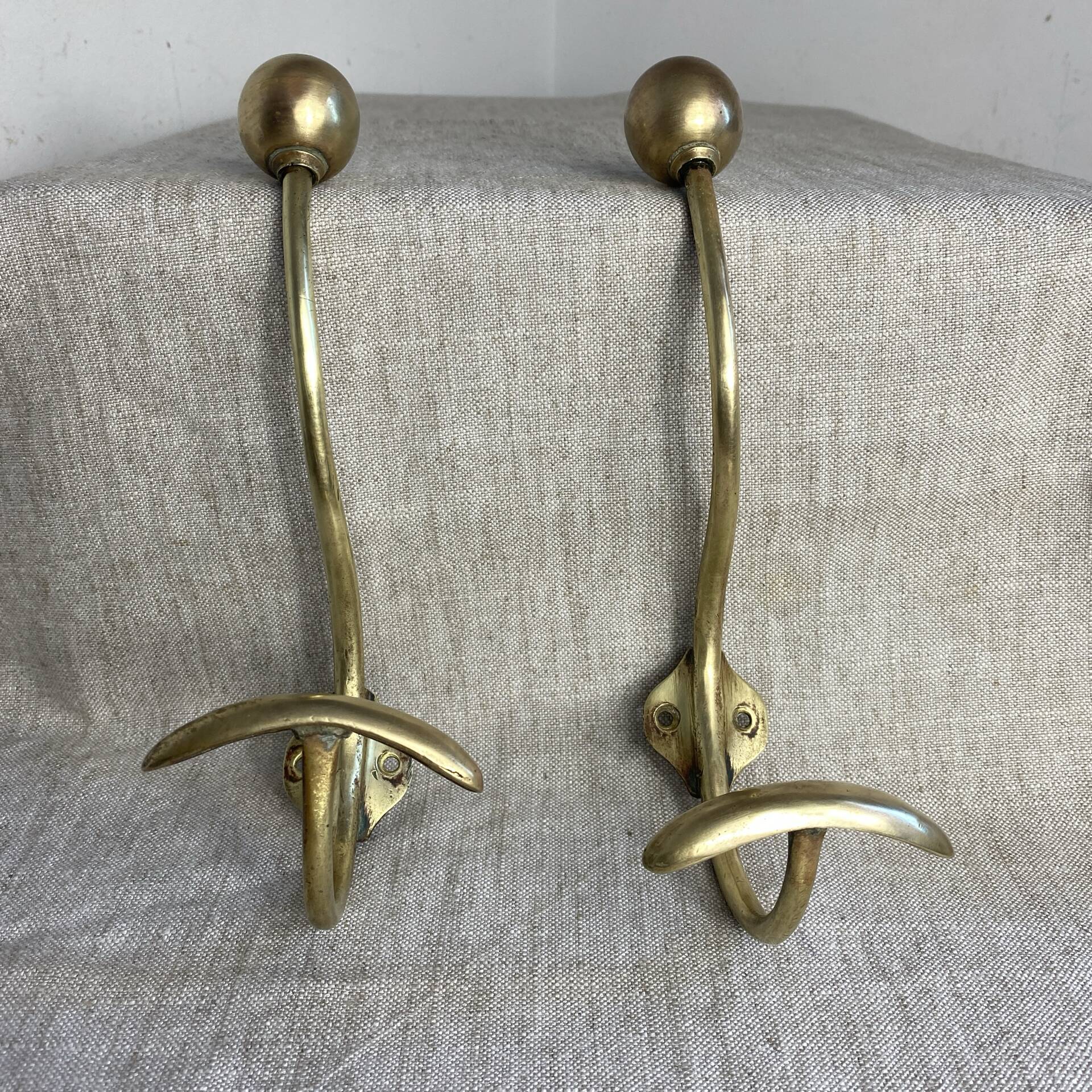 Pair of ball and hook coat hooks in brass