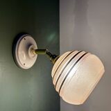 Vintage globe wall light in frosted pink and gold glass.
