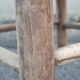 Vintage handmade wooden stool and rope