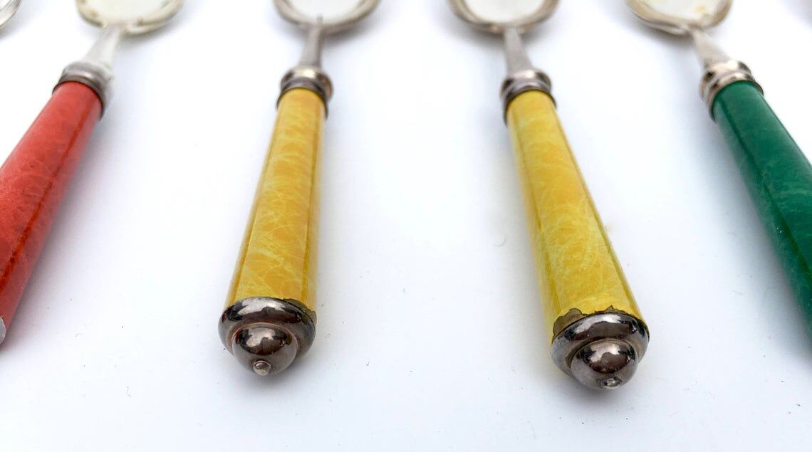 Set of eight enamelled silver spoons