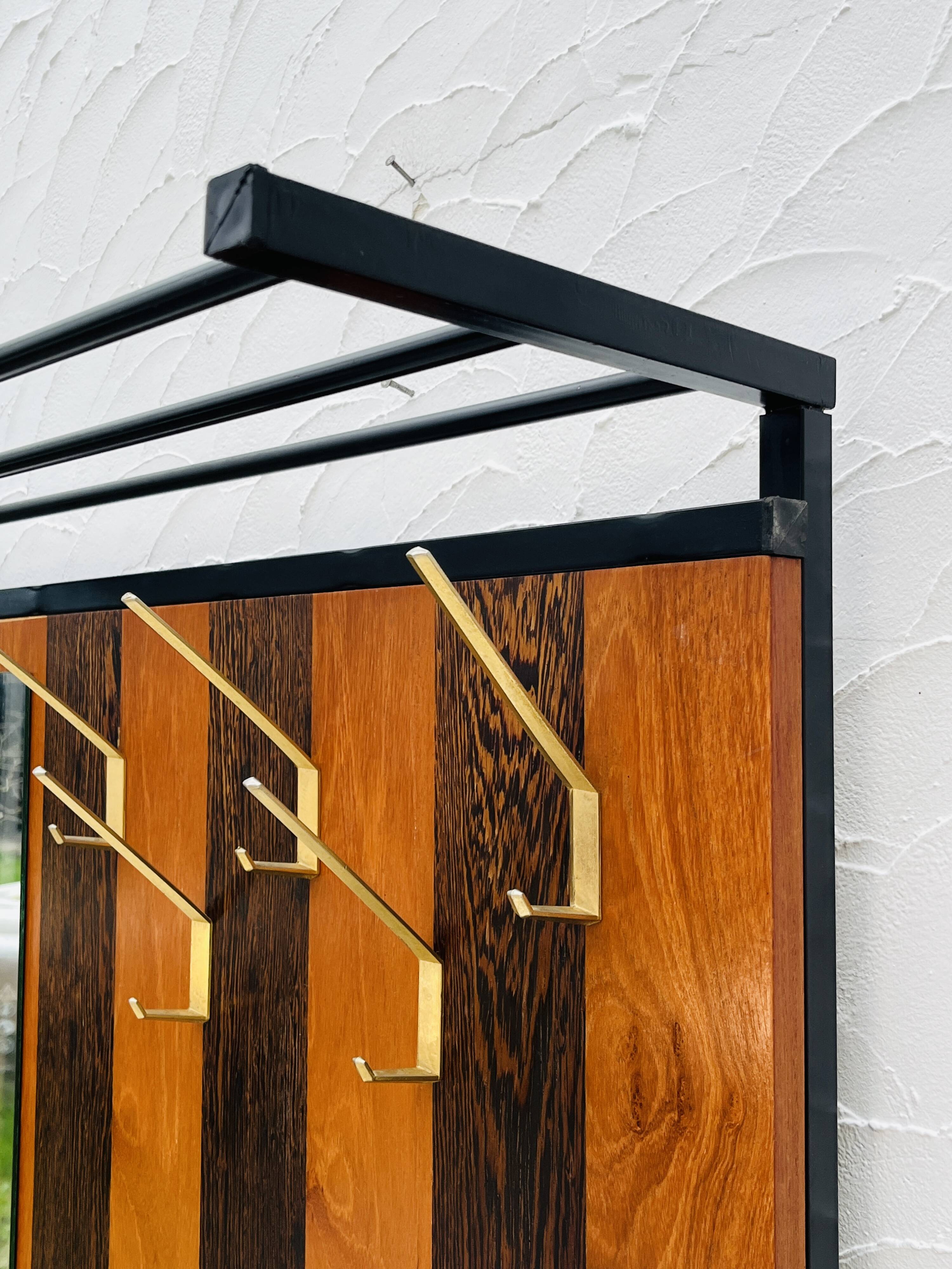 Vintage wall coat rack with storage bench from the 1970s.