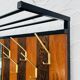 Vintage wall coat rack with storage bench from the 1970s.