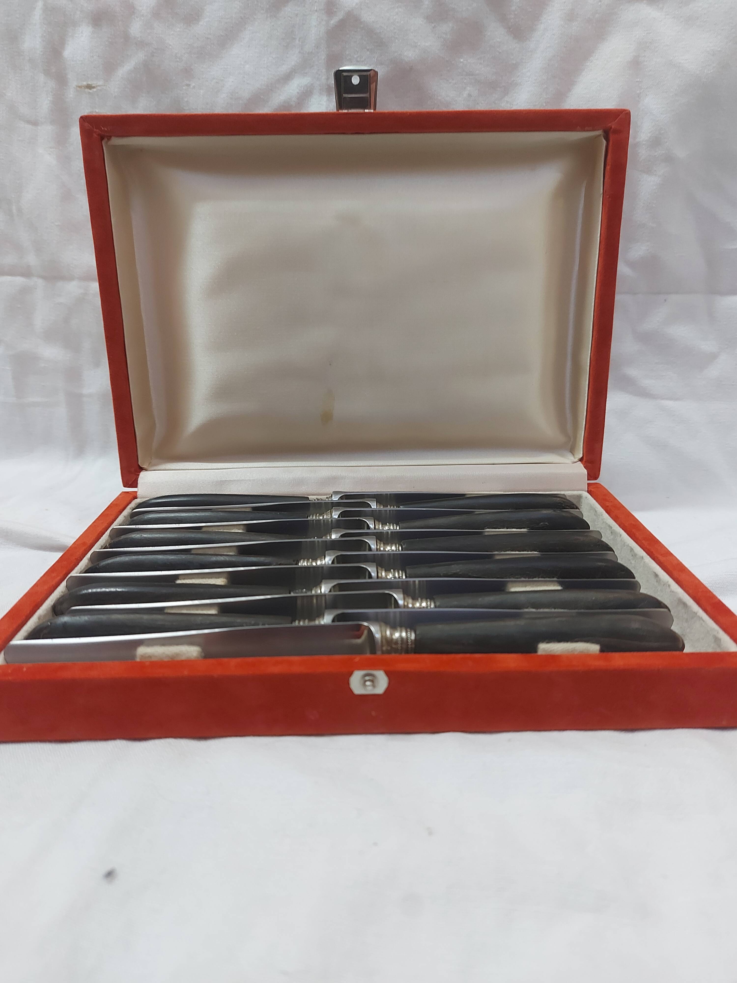 12 ebony handled knives, 1950