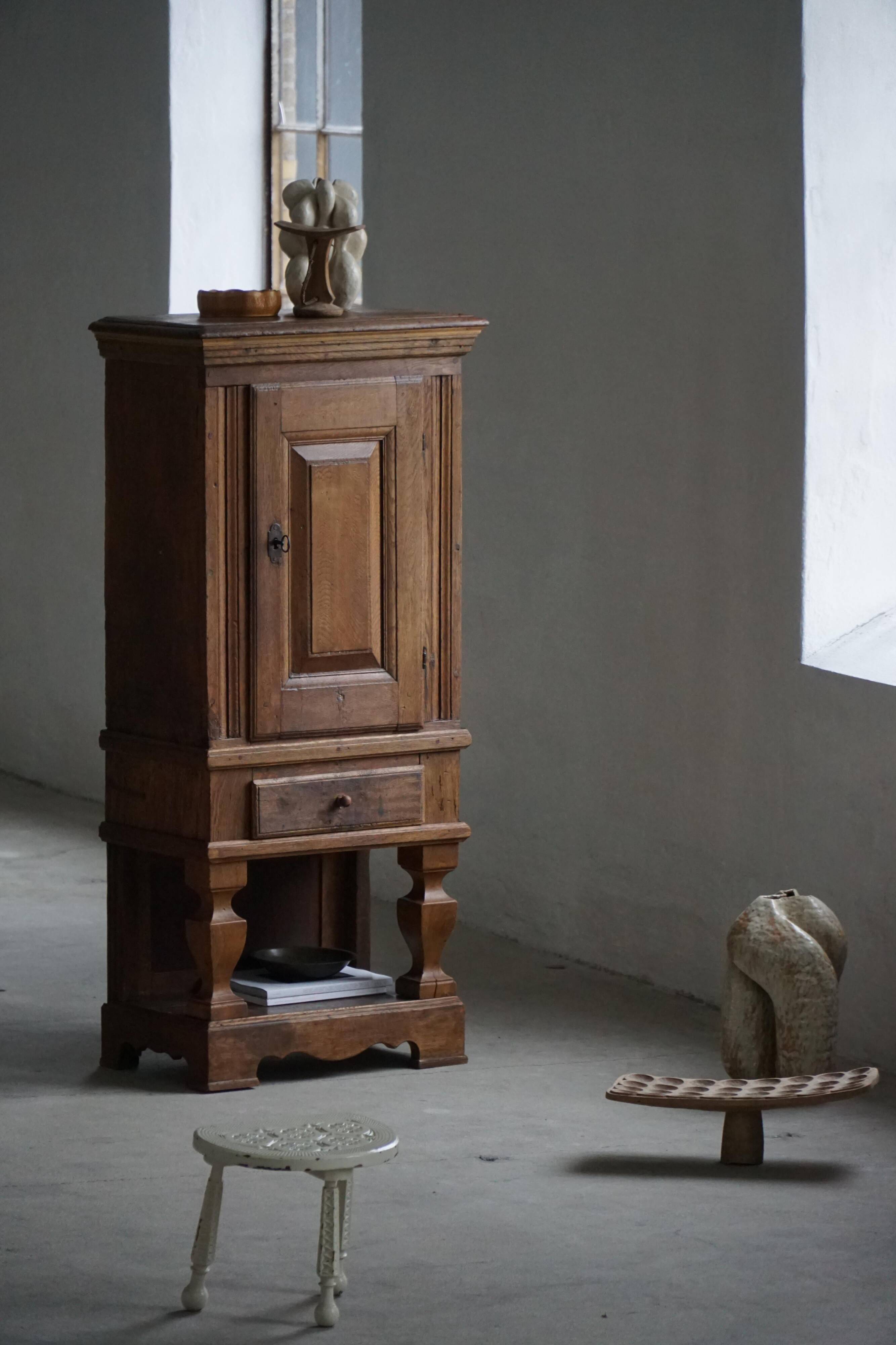 French rustic furniture in solid oak from the mid-19th century with panelled doors, baroque style.