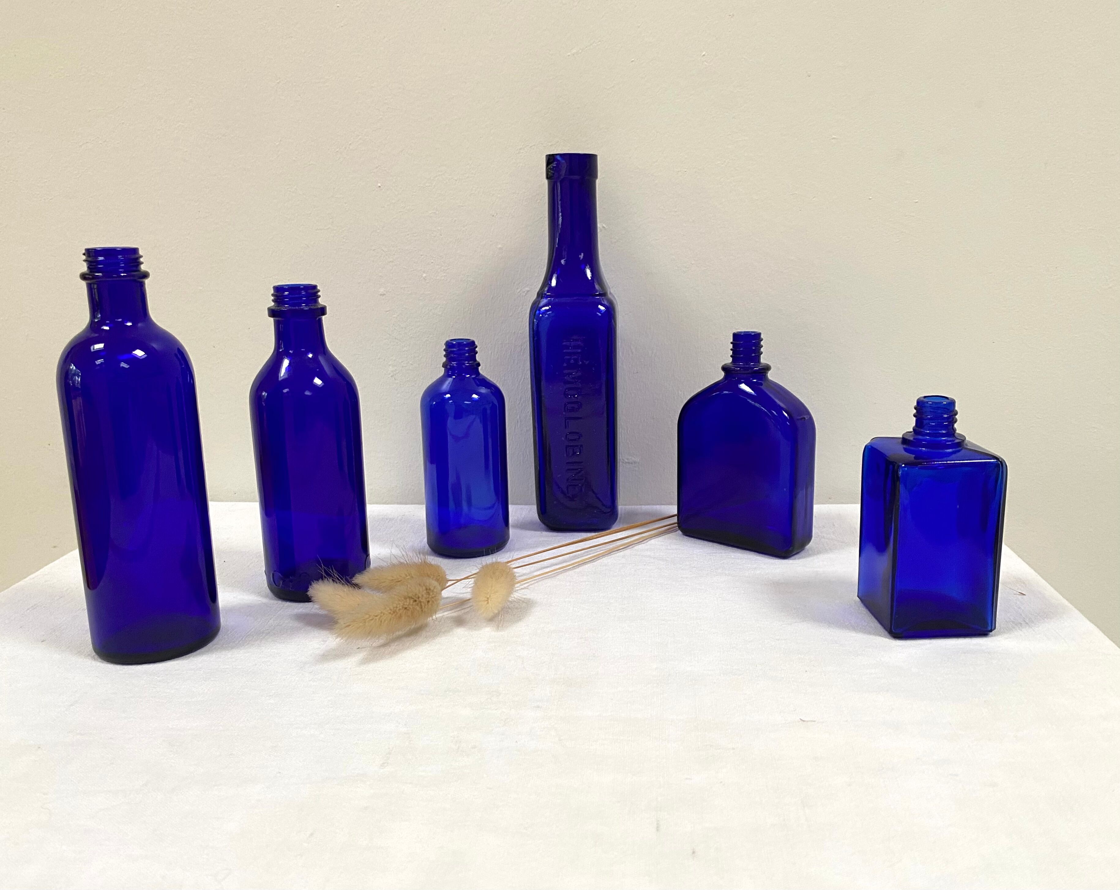 Set of 6 cobalt blue glass pharmacy bottles