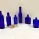 Set of 6 cobalt blue glass pharmacy bottles