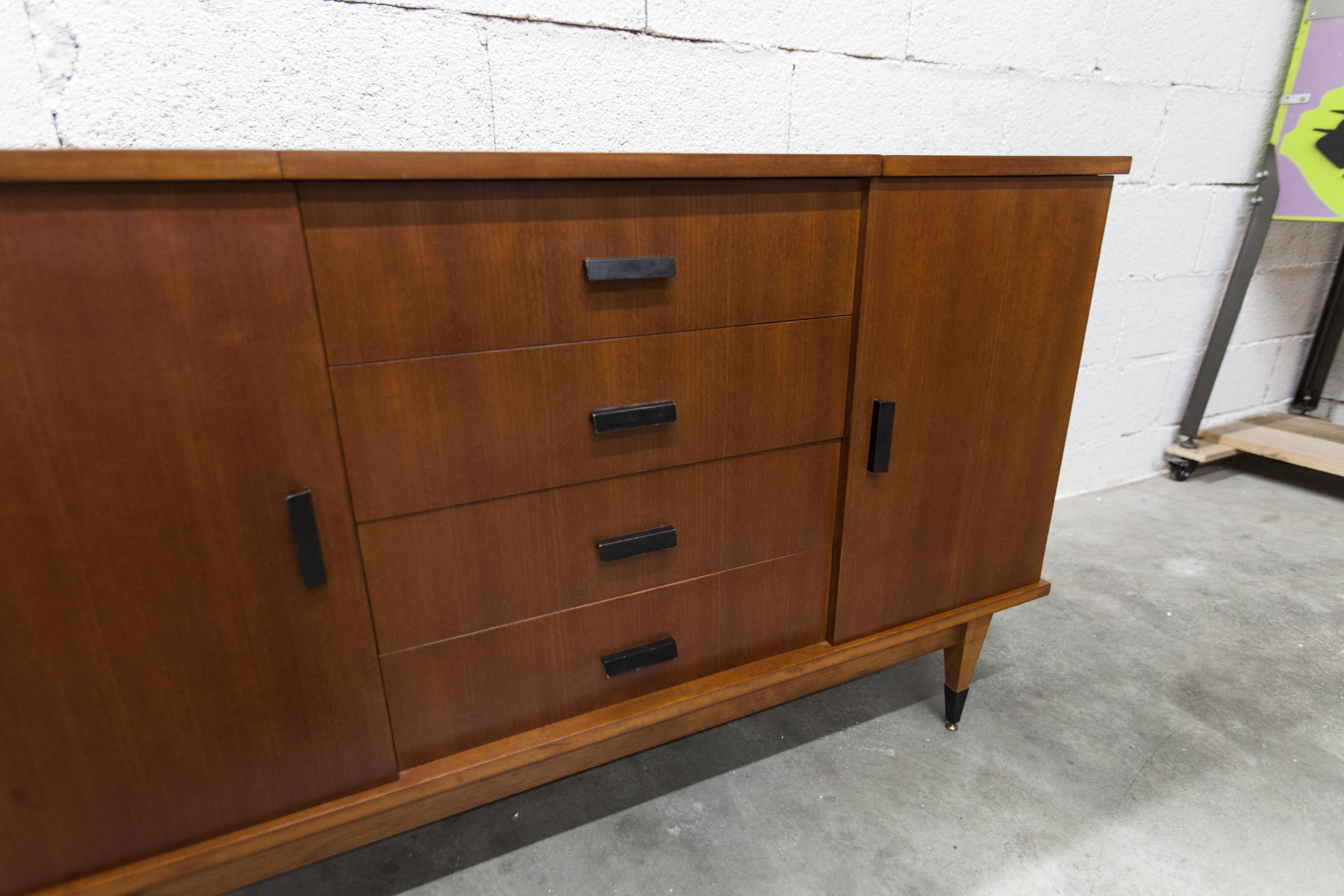 1960s teak sideboard with 4 drawers, 2 doors, and a mirror.