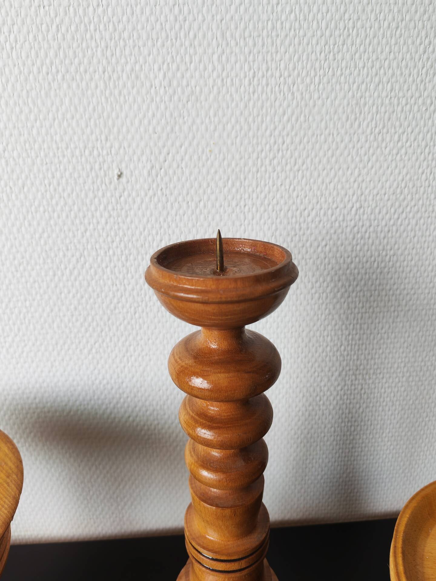 Vintage decor trio: candlestick and light wood bowls in Scandinavian style.