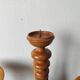 Vintage decor trio: candlestick and light wood bowls in Scandinavian style.