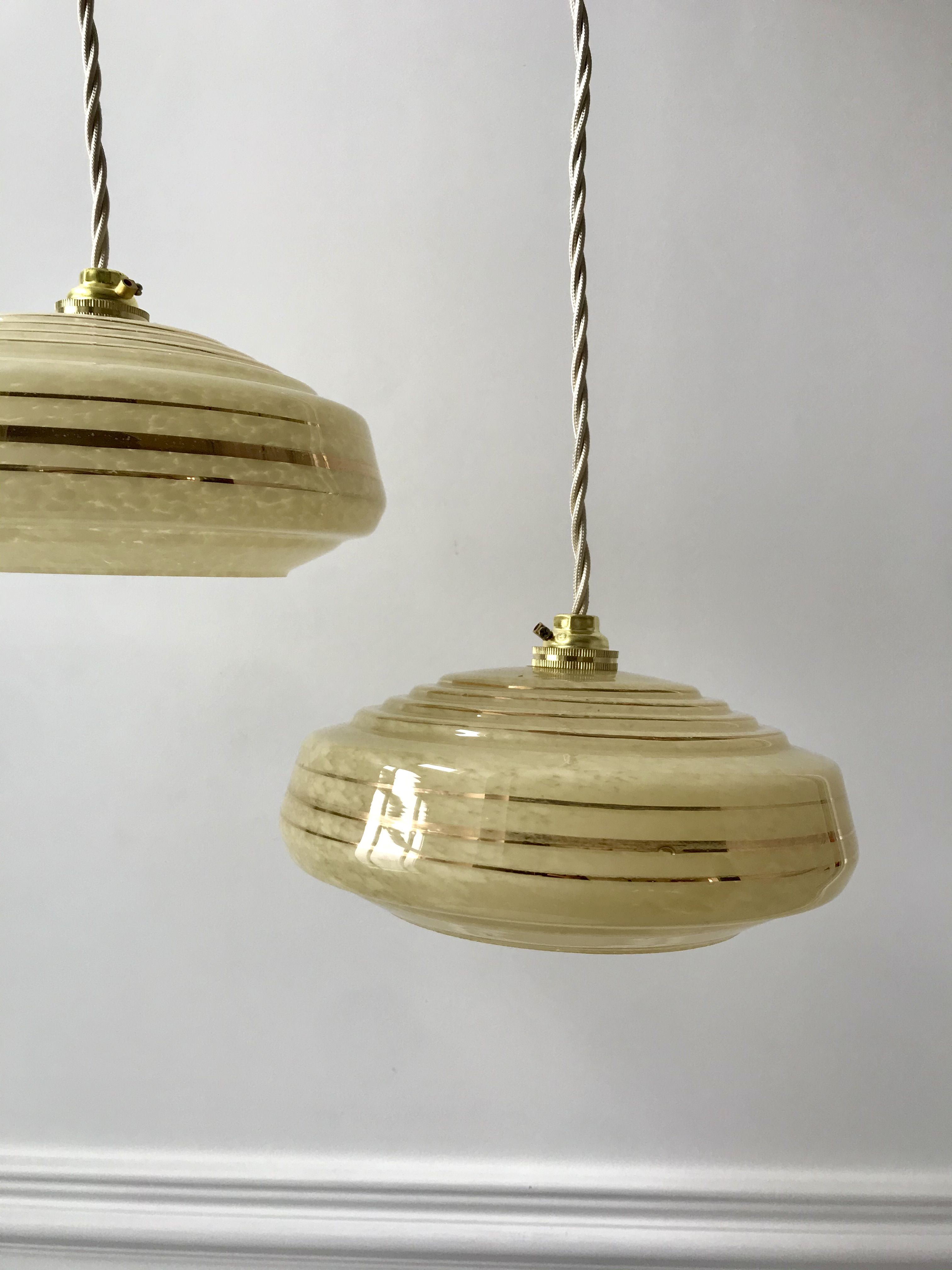 Pair of suspensions in yellow Clichy glass and golden border 40s-50s