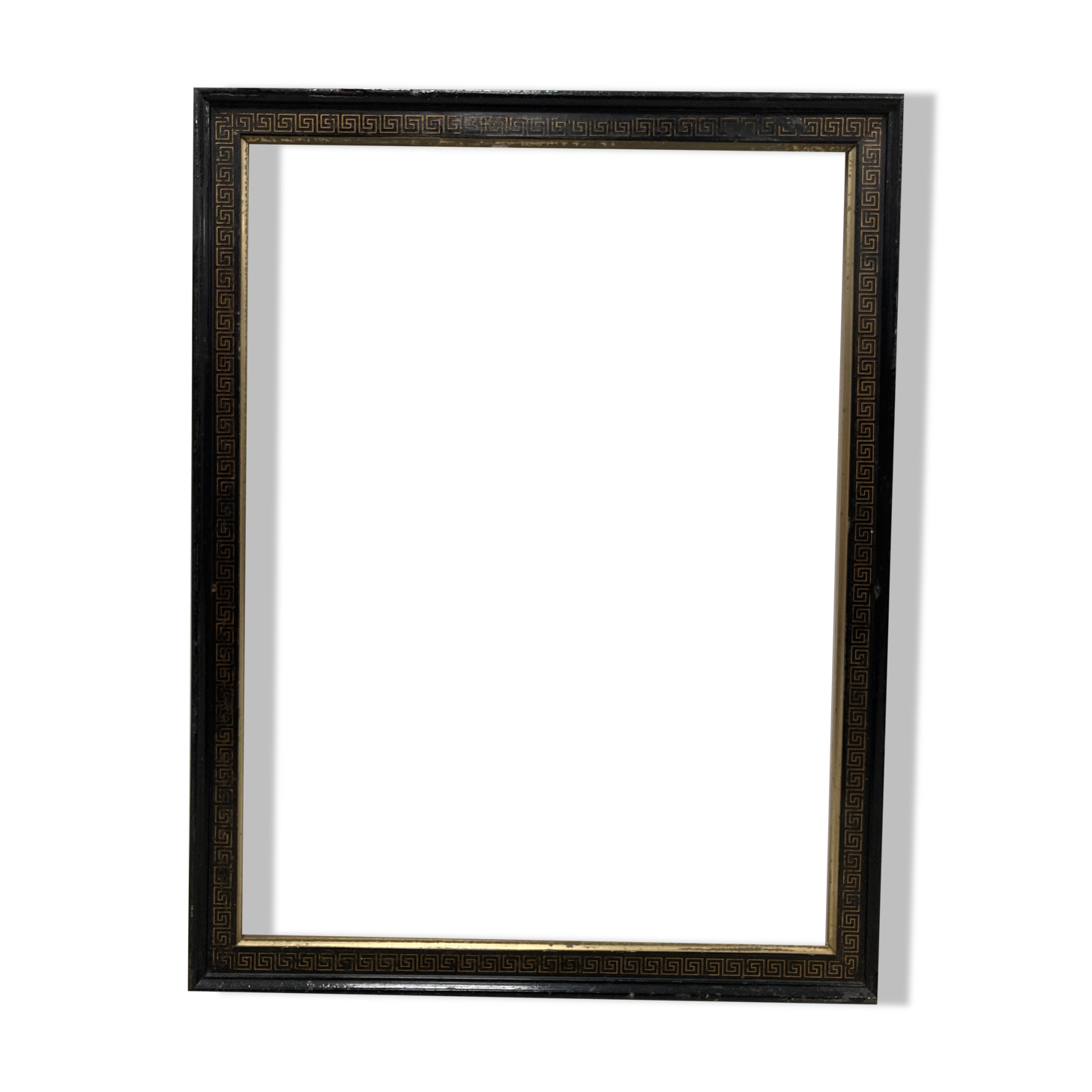 Black and gold frame decorated with Greek frieze decoration