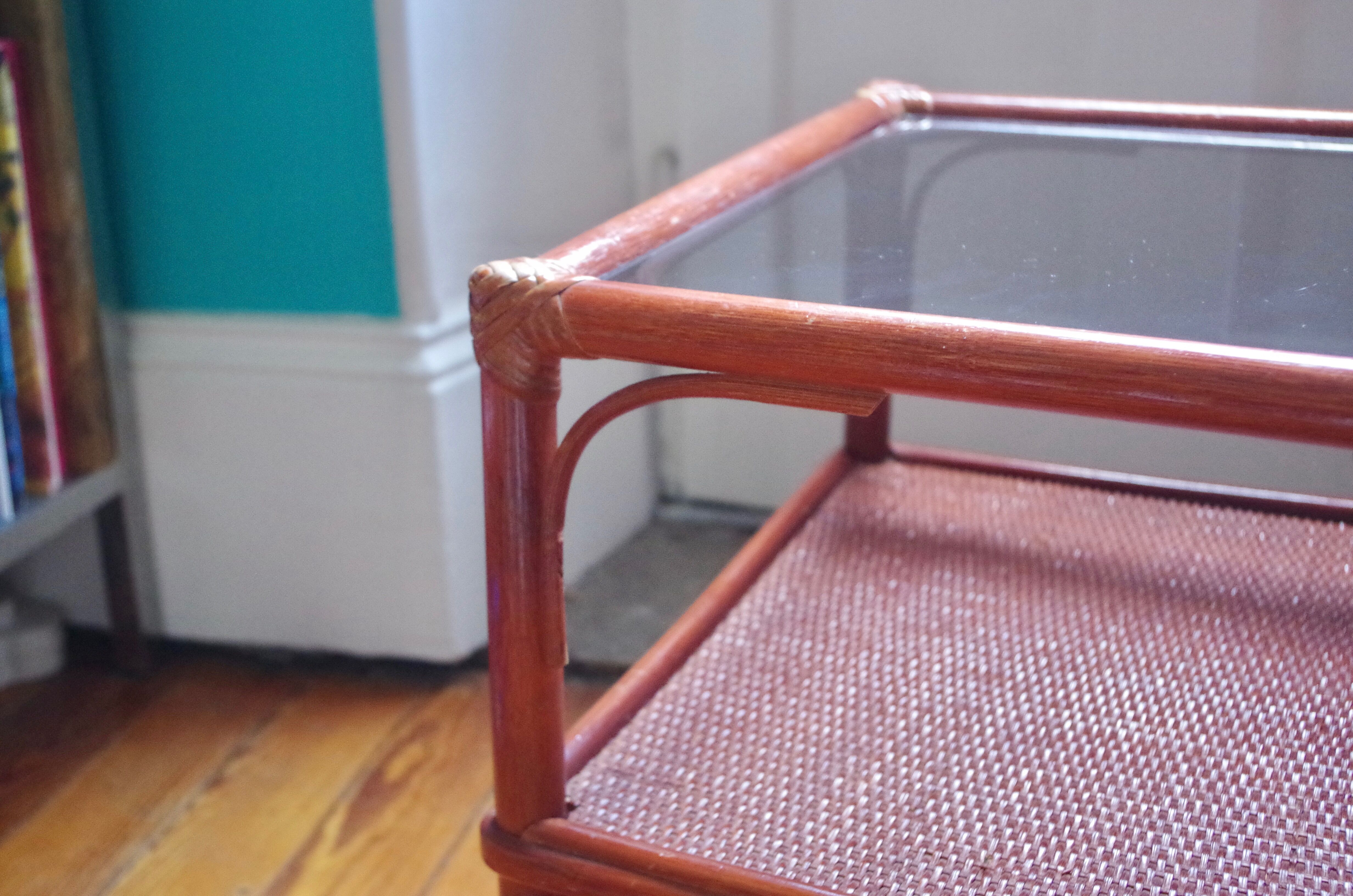Varnished rattan coffee table and smoked glass top