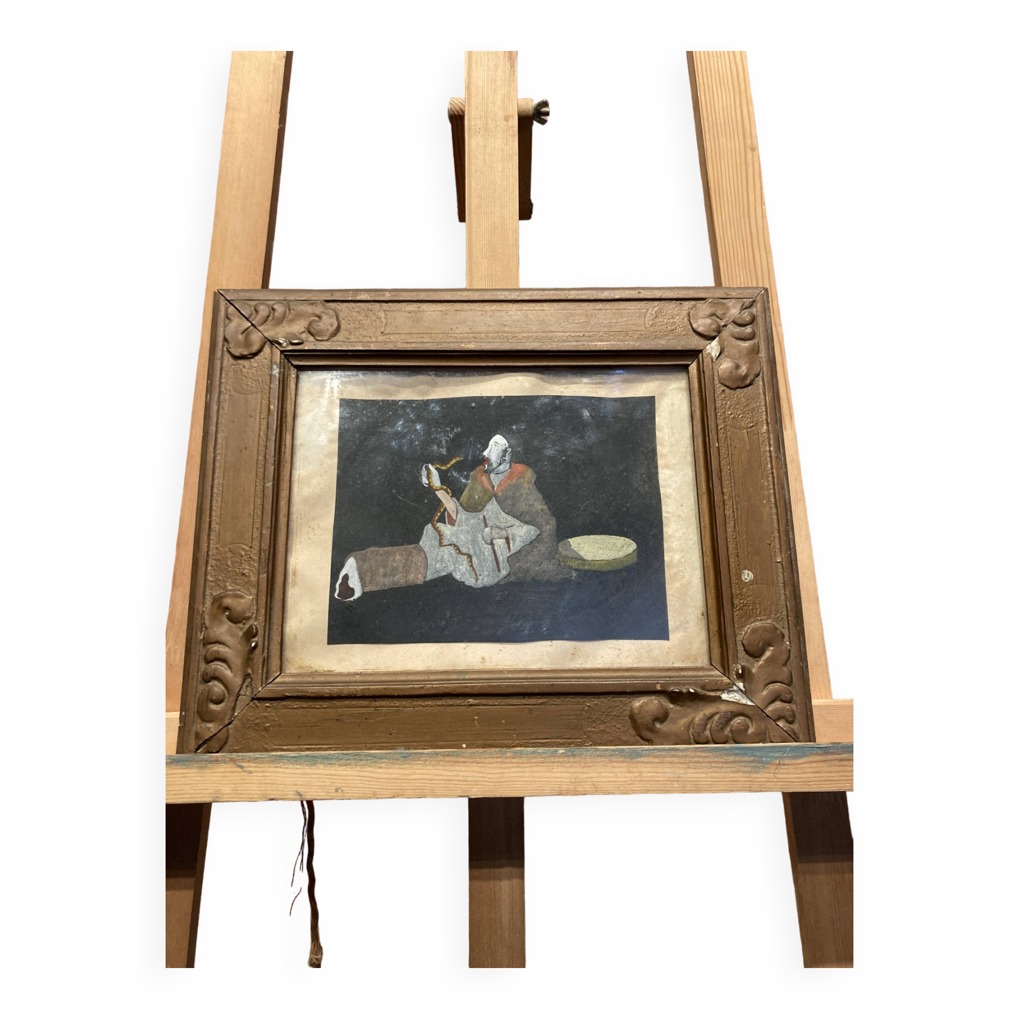 Framed painting of a man on mica.