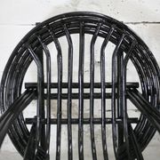 Pair of black lacquered rattan armchairs. France, cira 1960.