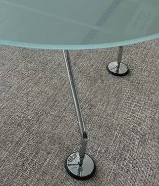 Nomos table by Norman Foster, glass and aluminium.