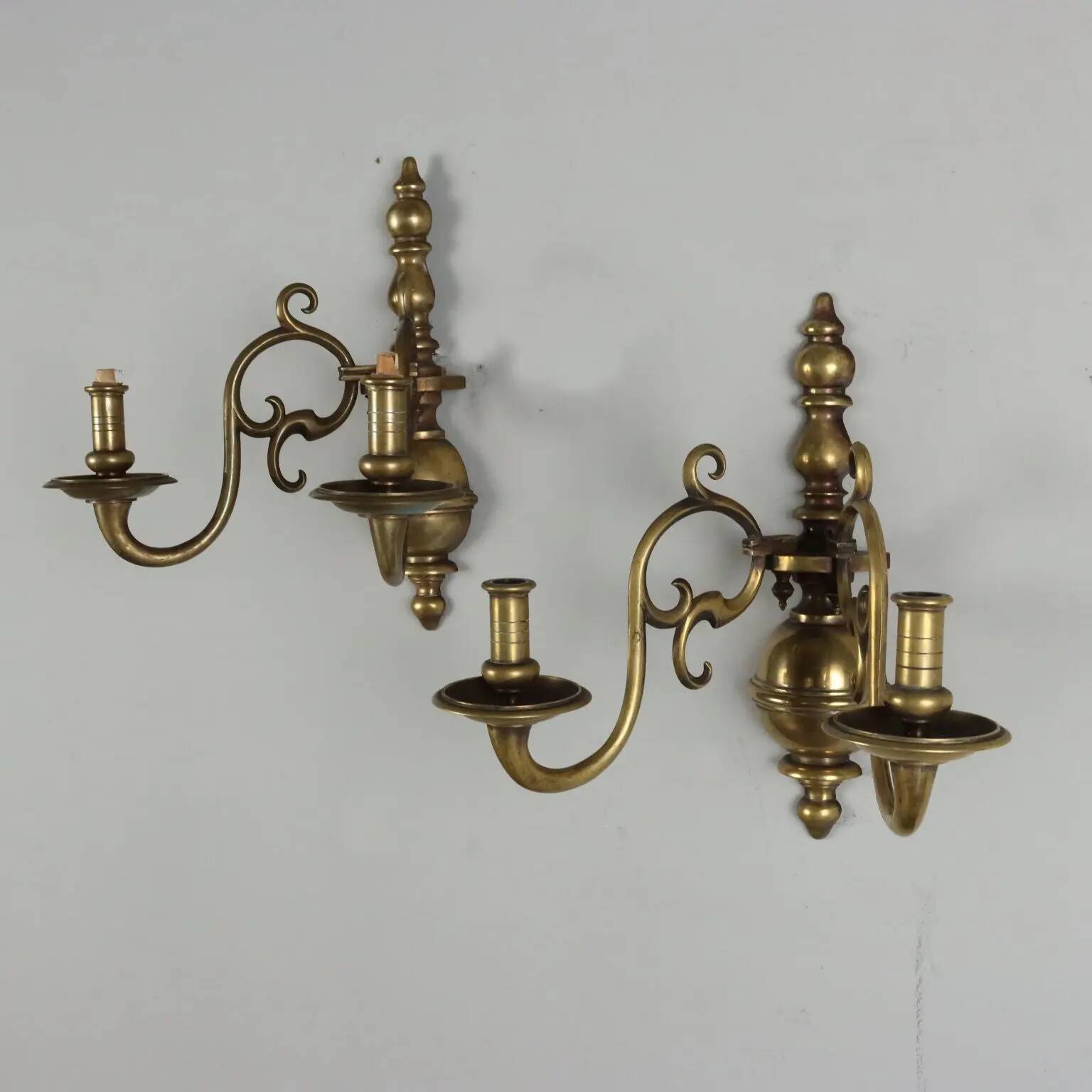 Pair of antique wall sconces in 20th-century Baroque style.