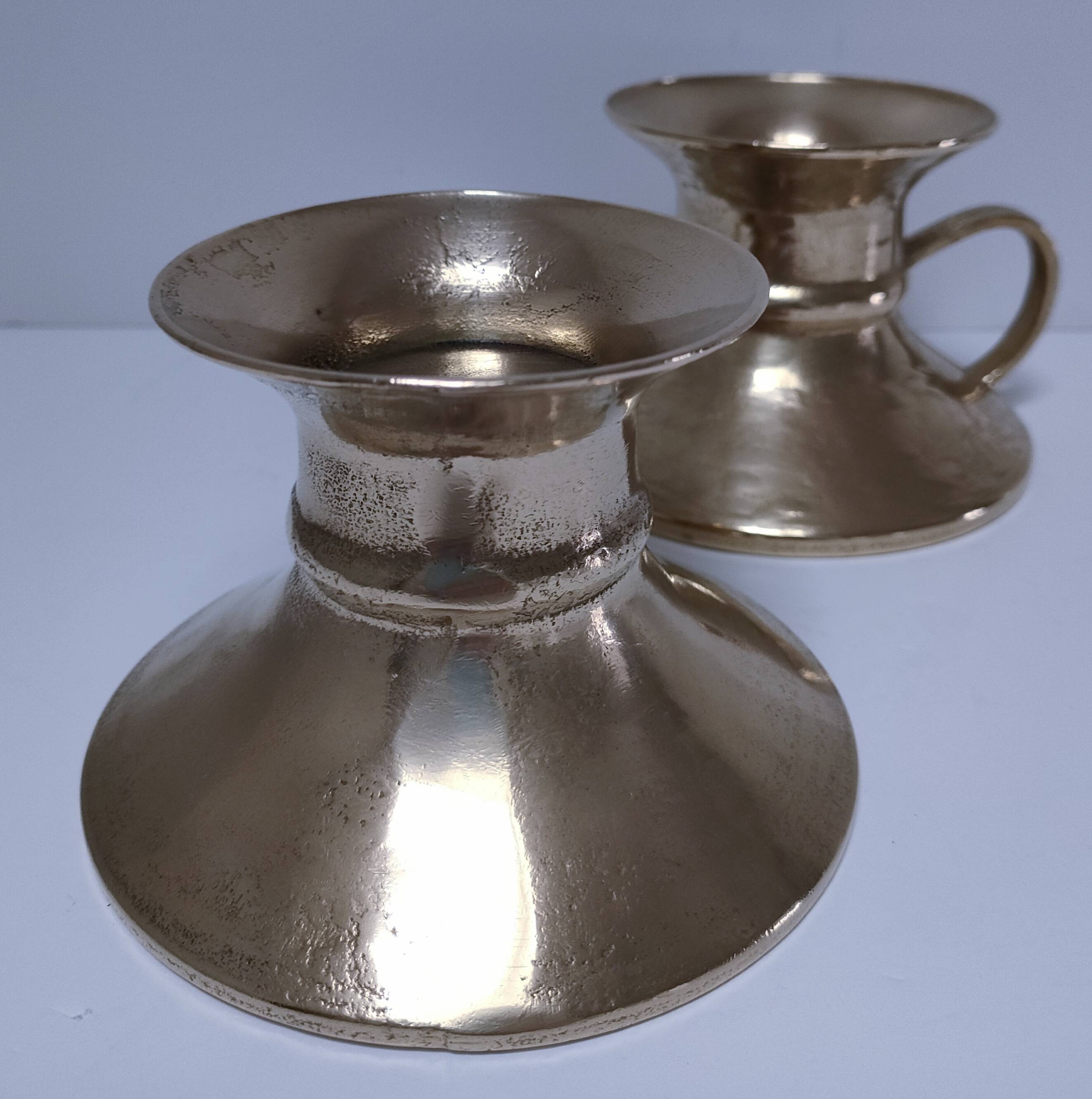 Pair of vintage solid brass hand candlesticks