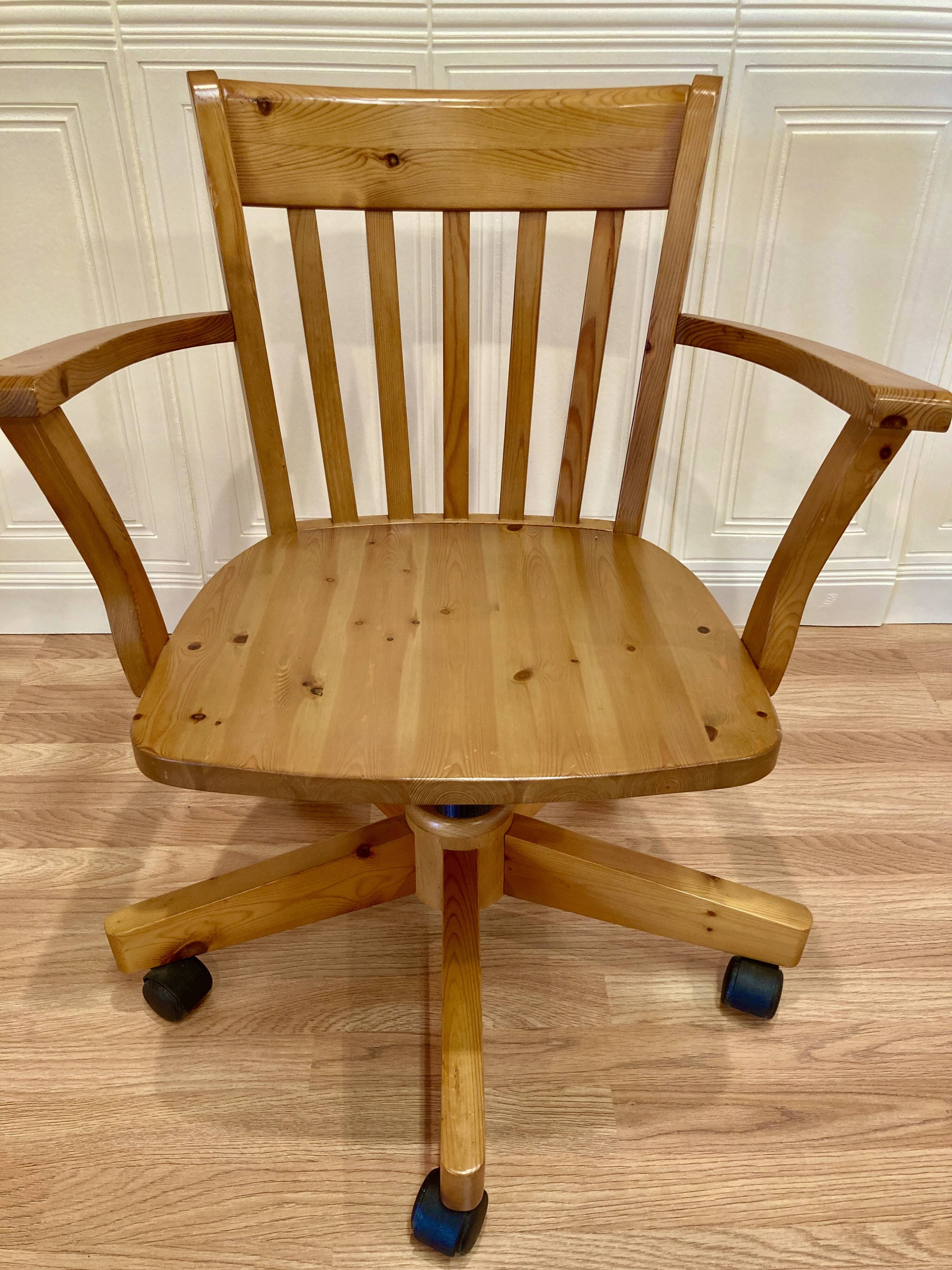 Solid wood swivel and reclining armchair.