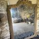Large antique mirror in wood and gilded stucco.