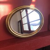 Golden oval mirror