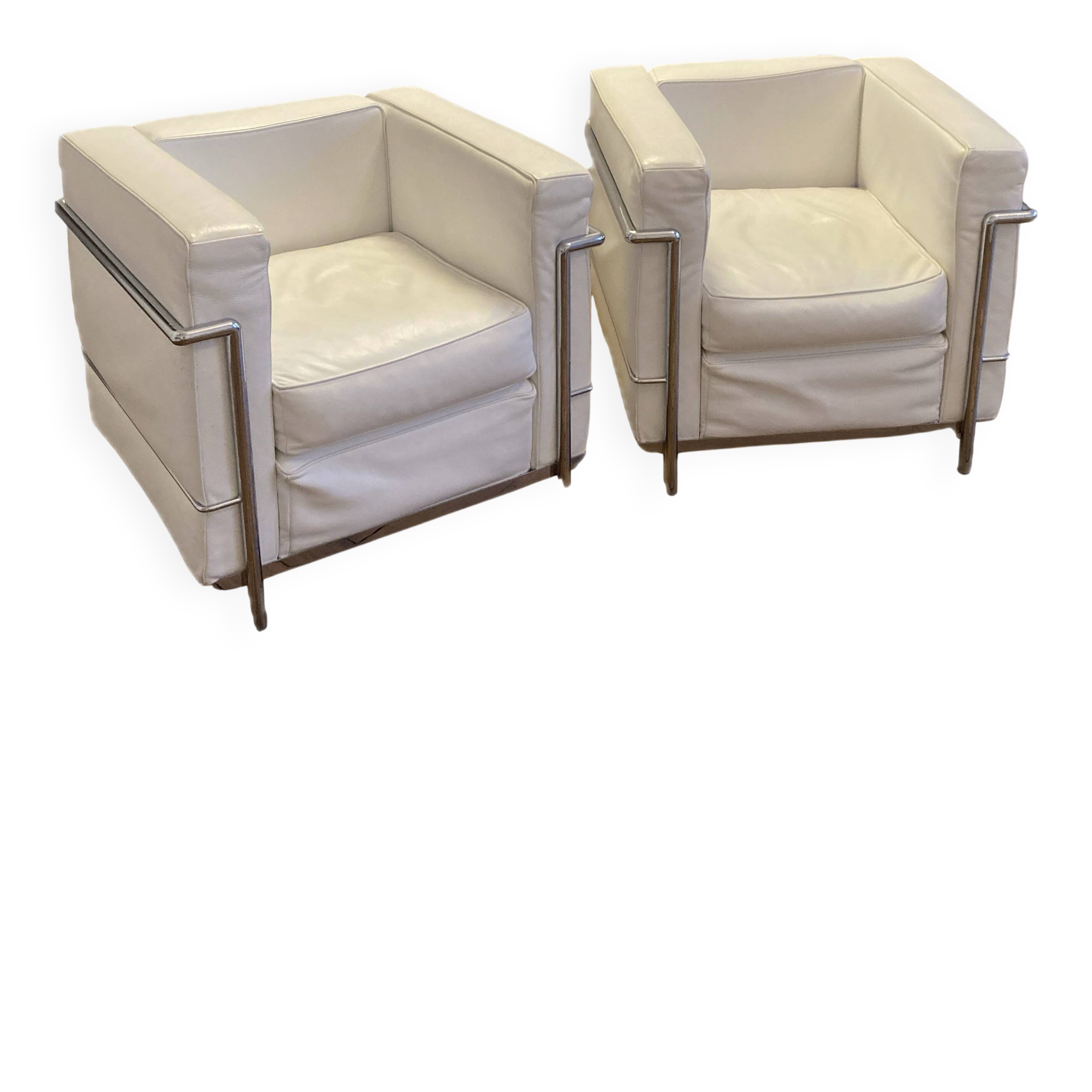 Pair of white leather and chrome armchairs