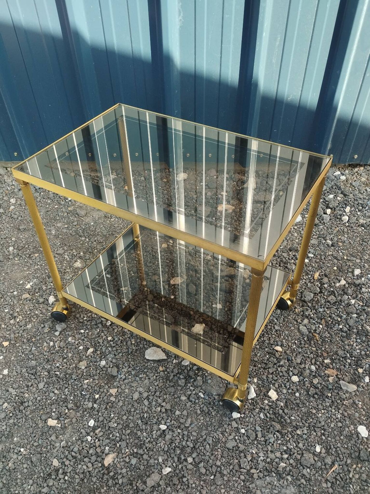 Vintage golden metal rolling dessert trolley