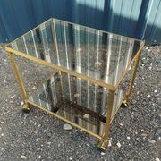 Vintage golden metal rolling dessert trolley
