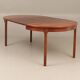Round dining table in rosewood.