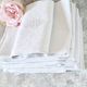 12 antique French linen towels with damask embroidery with "GB" anagrams.