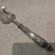 Fish serving fork with 950 silver handle, rococo cherub design