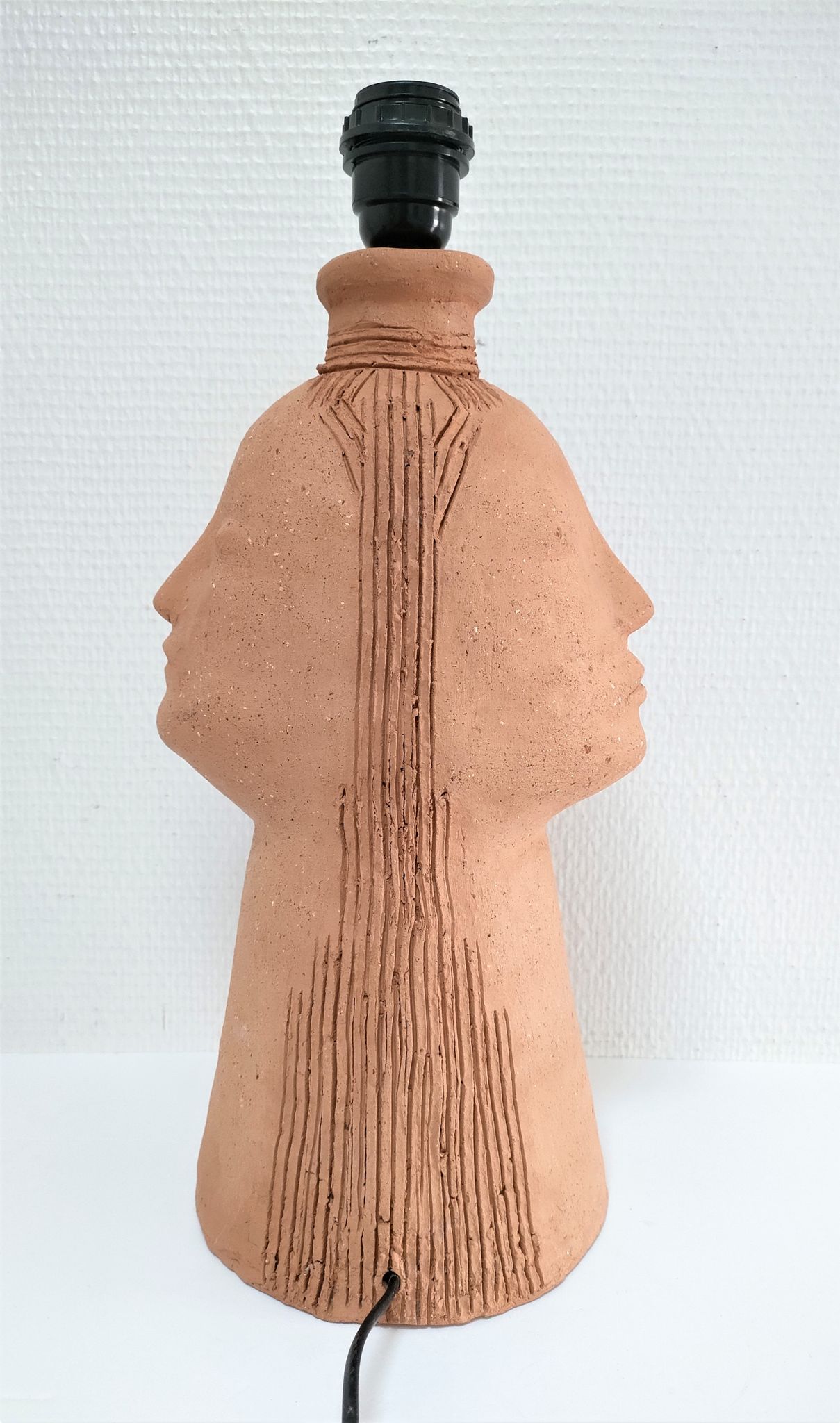 Anthropomorphic lamp foot depicting two faces terracotta design 80s