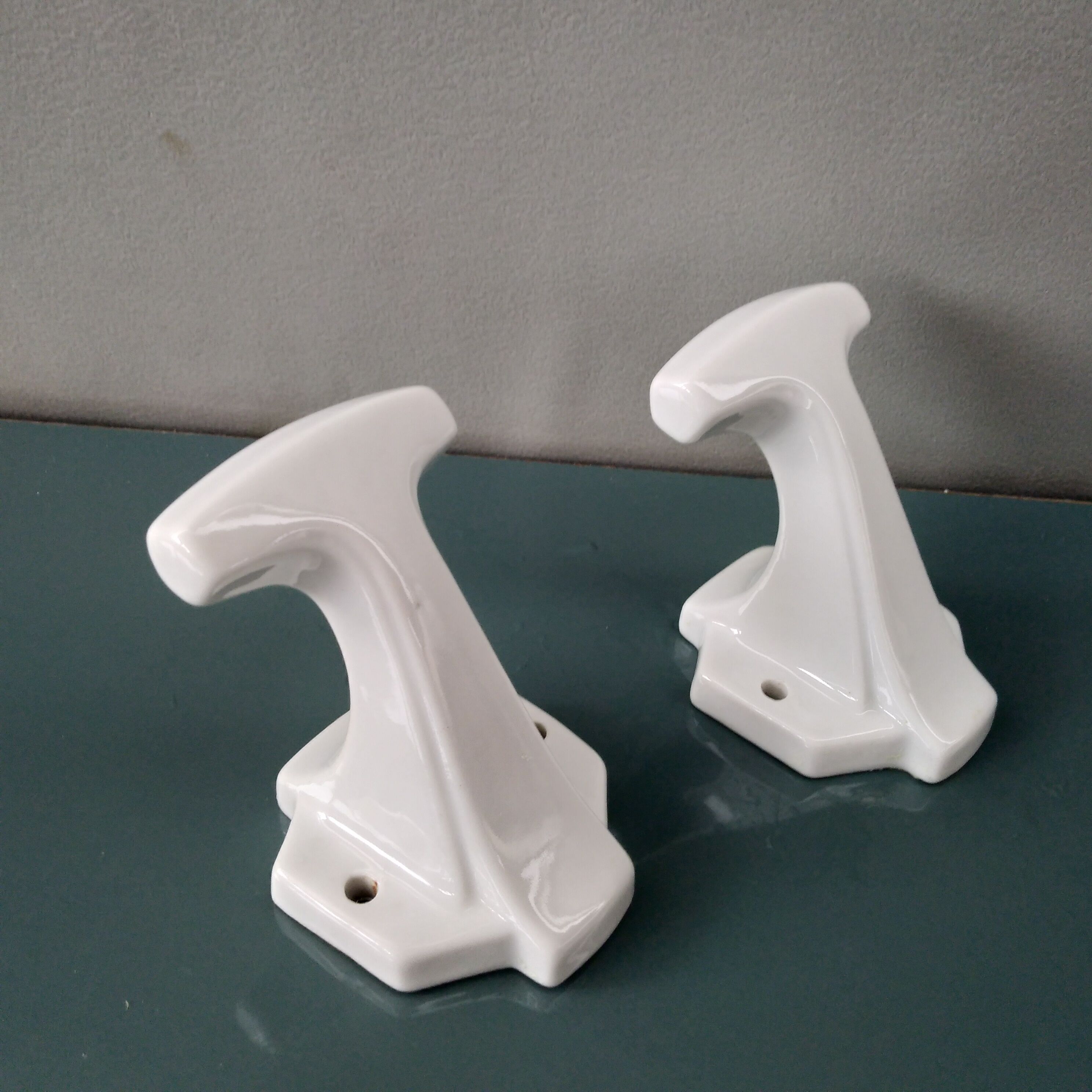 Pair of art deco porcelain coat racks