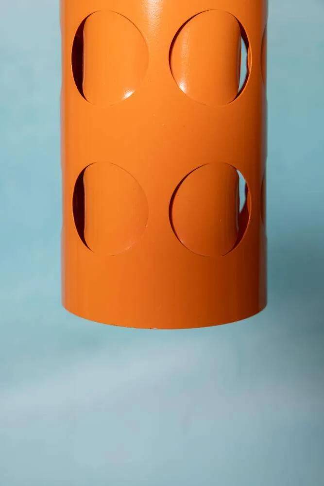 Vintage orange suspension light in a 1970s space age style.