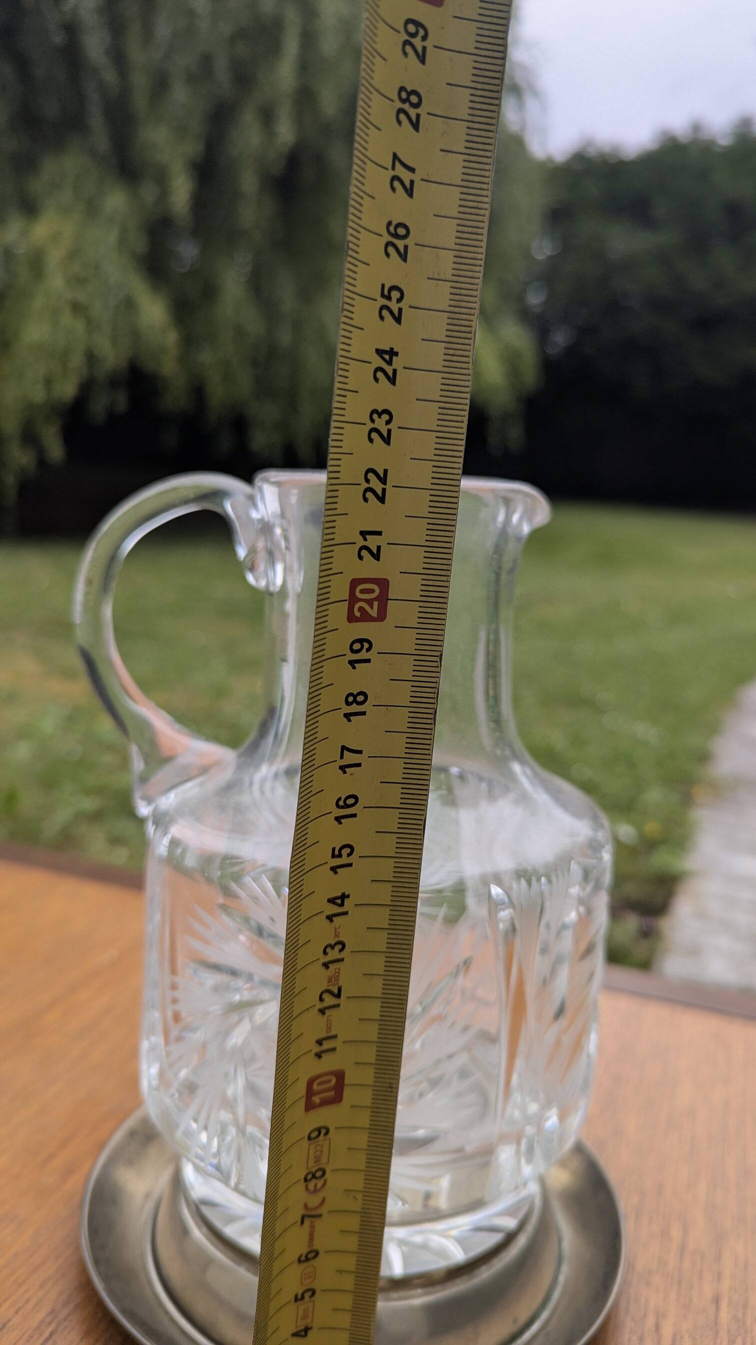 Jug / Carafe made of cut glass or crystal with its metal under-bottle.