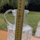 Jug / Carafe made of cut glass or crystal with its metal under-bottle.