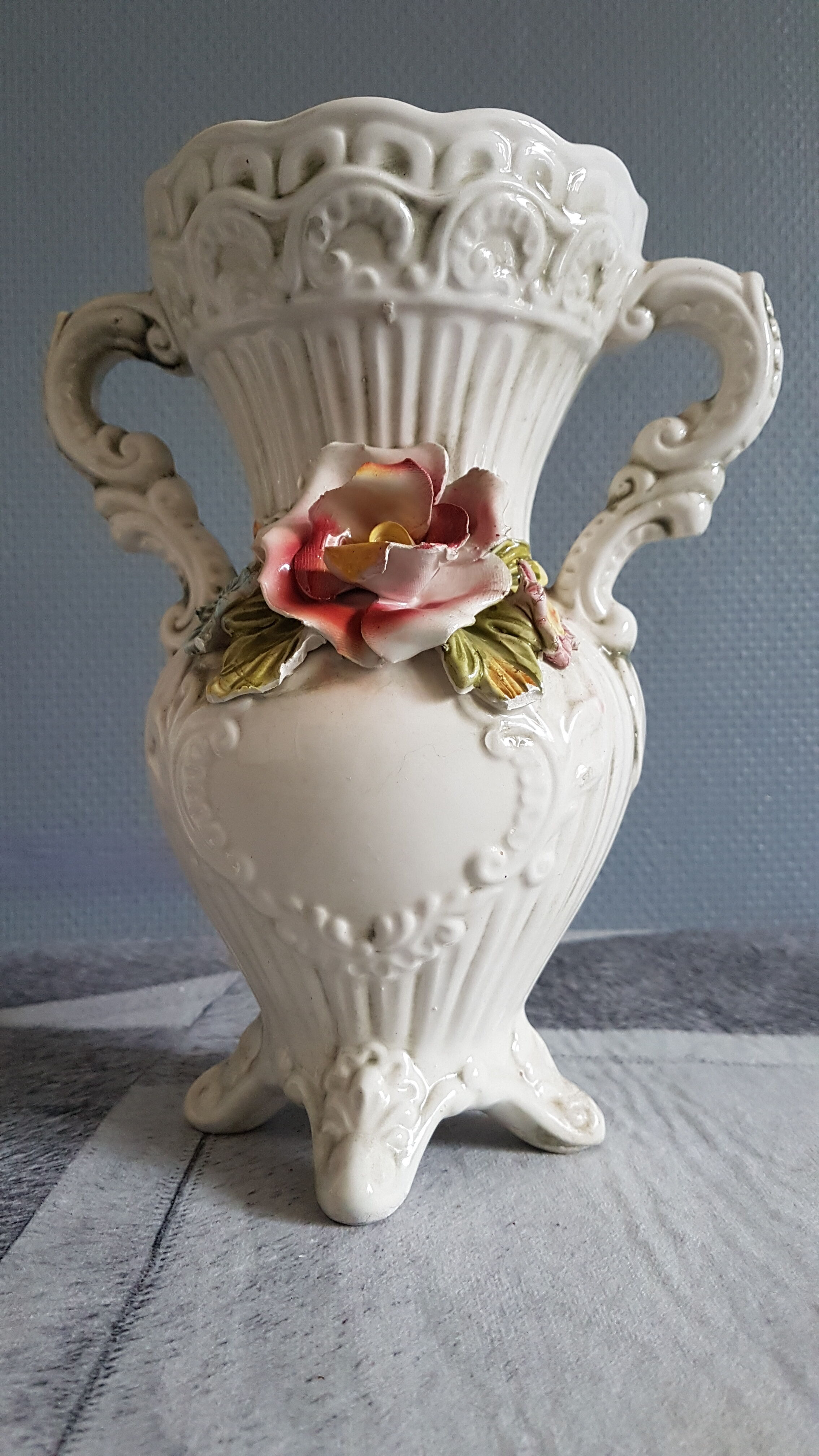 White dabbling vases with capodimonte porcelain floral decoration