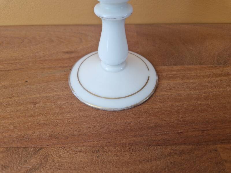 Footed glass in the shape of a chalice in white opaline with a floral decoration.