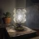 Antique globe table lamp in moulded transparent glass with a brass base.