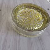 Empty round pockets of iridescent transparent glass of yellow sticks